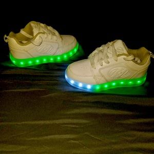 White roller led girls Heelys.